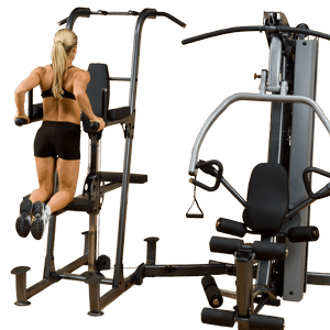 Performing dip exercise on wall mounted station