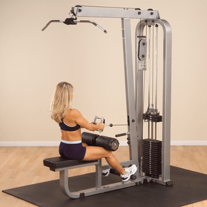 Performing Seated Low Row Exercise On Dual Function Machine