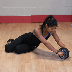 Performing rollout exercises using ab wheel