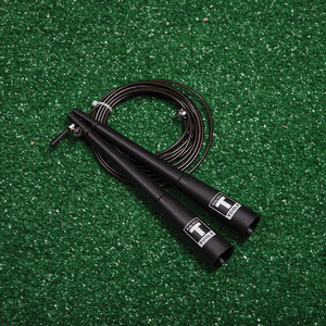 Cable speed rope placed on turf surface