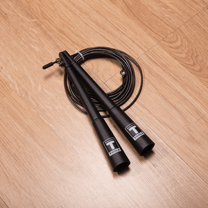 Cable speed rope displayed on wood floor