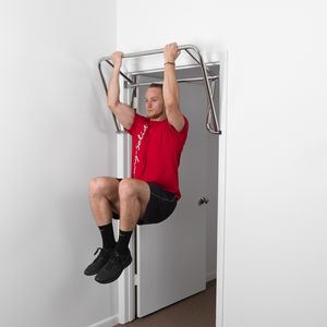 Knee raise exercise on doorway bar