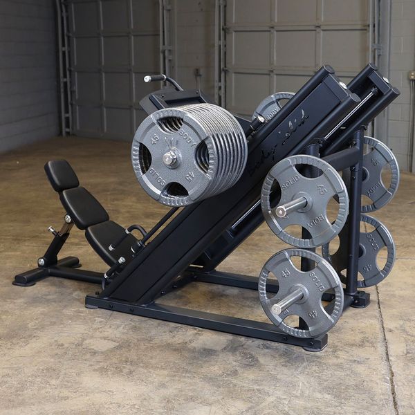 Leg press machine highlighting reinforced frame and sled rails