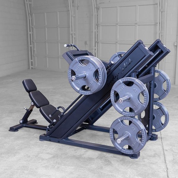 Strength training leg press machine built for smooth pressing motion