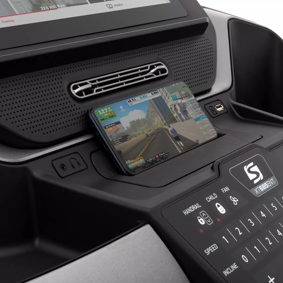 Using integrated phone holder during treadmill workouts